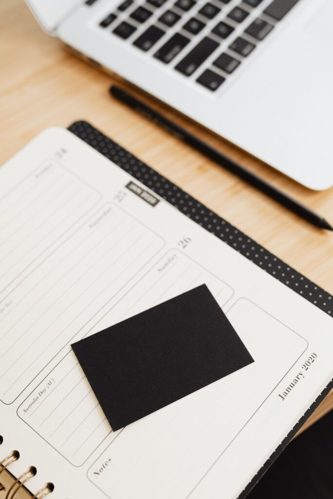 Planner, laptop, and stationery on an organized desk
