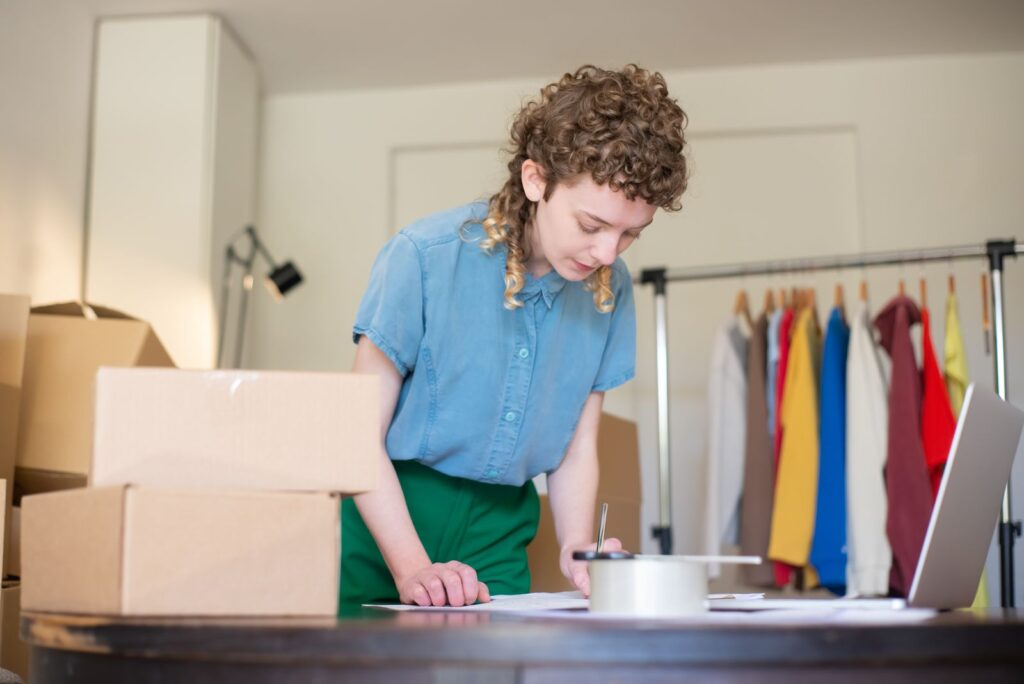 Woman packing online shop orders at home