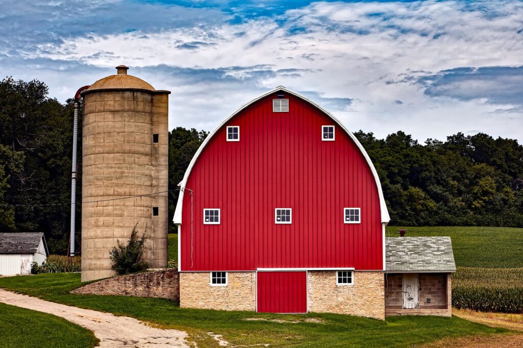 Red barn with a silo in the countryside